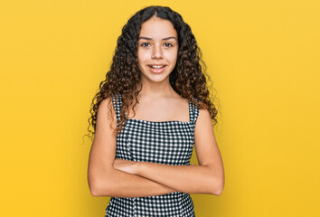 Wall Mural - Teenager hispanic girl wearing casual clothes happy face smiling with crossed arms looking at the camera. positive person.