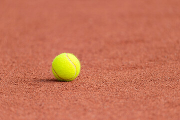 Wall Mural - Tennis ball on a tennis clay court. Horizontal sport poster, greeting cards, headers, website