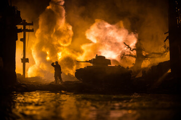 War Concept. Military silhouettes fighting scene on war fog sky background, World War Soldiers Silhouette Below Cloudy Skyline At night. Battle in ruined city. Selective focus