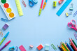 © photoguns - Back to school concept. Flat lay school stationery frame on a blue background. Top view, overhead.