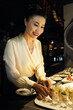 © DragonImages - Smiling beautiful restaurant manager checking of delicious appetizers are ready for serving