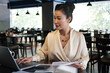 © DragonImages - Female restaurant owner checking reports with financial data and preparing documents for tax department
