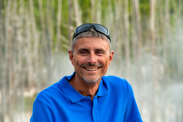 Poster - Man smiling outdoor visiting geysers.