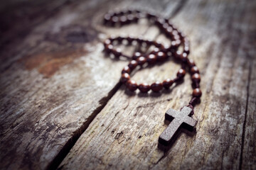 Poster - Rosary beads and religious crucifix cross background