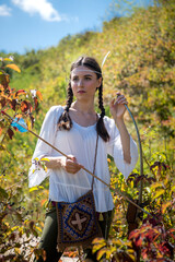 portrait of pretty Indian woman poses in a nature surrounding