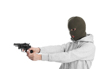 Woman wearing knitted balaclava with gun on white background