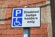 A sign saying 'disable badge holders only' can park, England, UK
