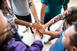 © Rawpixel.com - Team members' hands all in the center