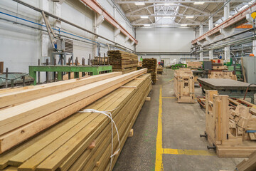 Wall Mural - Typical woodworking factory interior, large workshop with automated machines and stacks of timber.