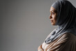 © Drobot Dean - Middle eastern woman in hijab posing and looking aside