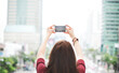 © Rawpixel.com - Woman taking a photo with her phone
