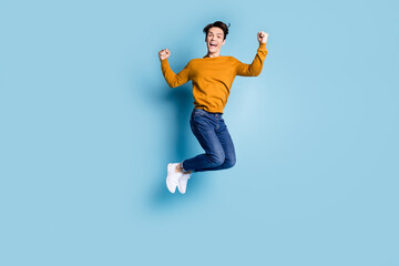 Sticker - Full size photo of funny brunet millennial guy jump wear sweater jeans isolated on blue color background