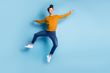 Sticker - Full body photo of crazy brunet millennial guy dance wear sweater jeans isolated on blue color background