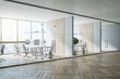 © Who is Danny - Sunny hall of modern office area with parquet, stylish workspaces, wooden decoration on wall and glass transparent walls and doors