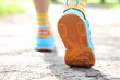 © megaflopp - Leg of man taking step in sports sneakers closeup