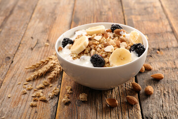 Wall Mural - bowl of oatmeal with yogurt and fruits