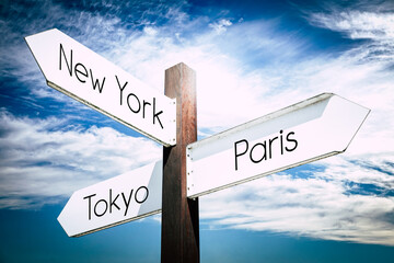 Wall Mural - New York, Paris, Tokyo concept - signpost with three arrows