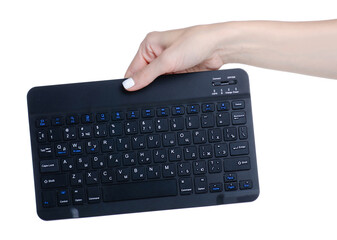 Black mini PC keyboard in hand on white background isolation