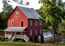 Red Starr's Mill Historic Millhouse, Dam And Waterfall In Fayette County Georgia During Sunrise In Summer