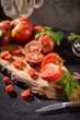 © homydesign - Tomatoes on rustic kitchen counter