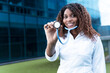 © carlos - young female doctor smiles while showing her stethoscope to the camera. High quality photo