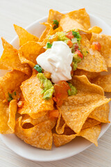 Sticker - nachos tortilla chips with jalapeno, guacamole, tomatoes salsa and dip