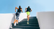 © Maridav - Stairs runners running up staircase training hiit workout. Couple working out legs and cardio at fitness gym. Healthy active lifestyle sport people exercising climbing staircase in urban city.