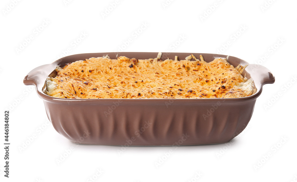Baking dish with tasty green lasagna on white background
