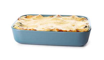 Baking dish with tasty green lasagna on white background