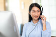 © NVB Stocker - Happy Asian woman operator and team working with headsets and desktop computer at telemarketing customer service. callcenter