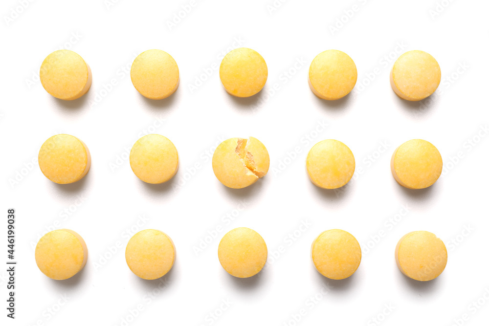 Vitamin K pills on light background