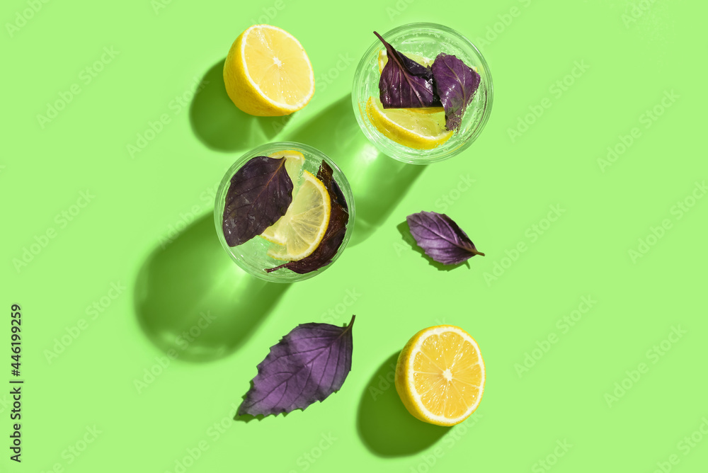 Glasses of tasty lemonade with basil on color background - obrazy, fototapety, plakaty 