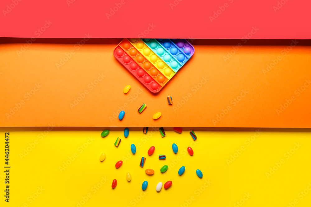 Composition with pop it fidget toy on color background