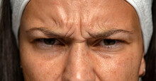  Frowning Woman With Wrinkles On Her Forehead