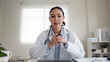 © ChayTee - POV screen of young asia people or female doctor live speak talk look at camera work in online clinic help patient on digital telehealth telemedicine smart covid consult VoIP service app on computer.