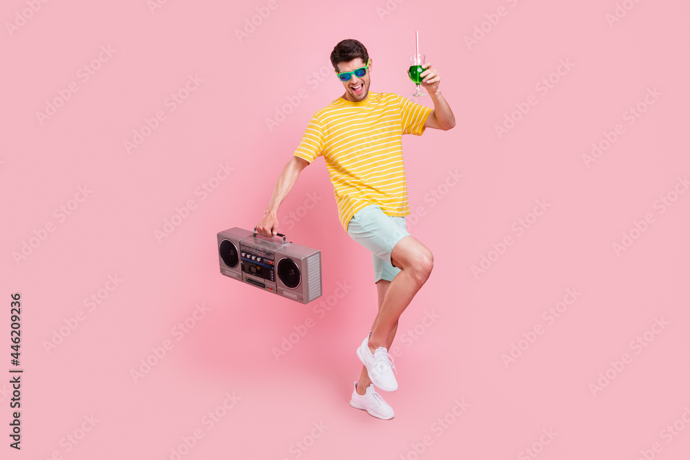 Full size photo of cheerful young happy man hold hands boombox drink dance isolated on pink color background - obrazy, fototapety, plakaty 