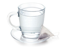 Hot Water In Glass And Teabag On White Background