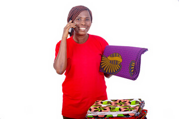 beautiful smiling woman talking on mobile phone while holding traditional loincloth.