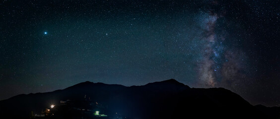 Wall Mural - khinalig village at night against the background of the milky way