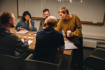 Businesswoman having conference meeting with colleagues