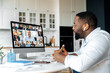 © Kateryna - Distant meeting, online communication. African American business man has a virtual meeting with multiracial business colleagues, discussing financial strategy, talking on a video call, brainstorming