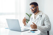 © Stock 4 You - Portrait of indian man doctor talking to online patient on laptop screen