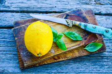 Wall Mural - Fresh organic lemon on wooden cutting board