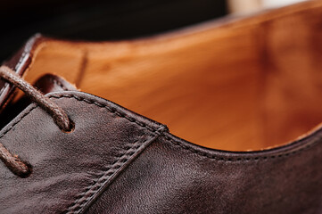 Wall Mural - Brown leather men's shoes made of genuine leather in classic style close-up. High quality photo