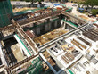 PENANG, MALAYSIA -MAY 3, 2020: Structural work is underway at the construction site. Work is carried out in stages according to the sequence of work. The workers practice standard safety methods. 