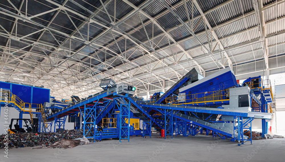 A modern plant for sorting and recycling household waste and waste. Large industrial complex of conveyors, bunkers.