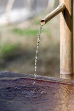 Water Flowing From A Japanese Shishi Odoshi Bamboo Fountain
