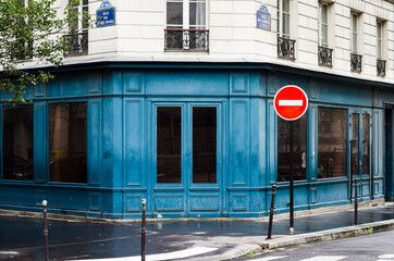 A classic blue building at the intersection of Rue de l'Ave Maria and rue des Jardins St. Paul in Paris, France.