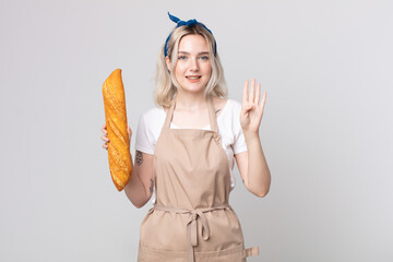 Wall Mural - young pretty albino woman smiling and looking friendly, showing number four with a bread baguette