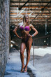 muscular female bikini fitness champion posing